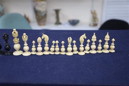 A mid 19th century Anglo Indian turned black stained and natural ivory chess set, kings 3.5in.